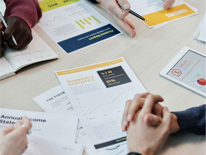 Business professionals reviewing company setup documents